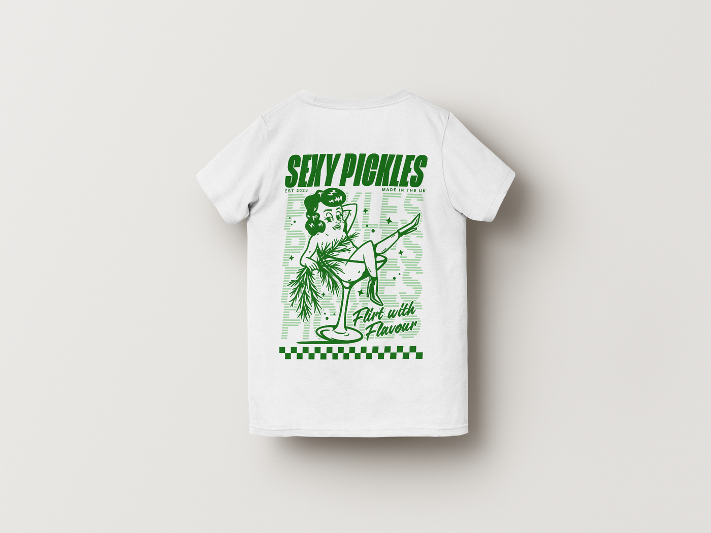 White t-shirt with green graphic design on a light gray background