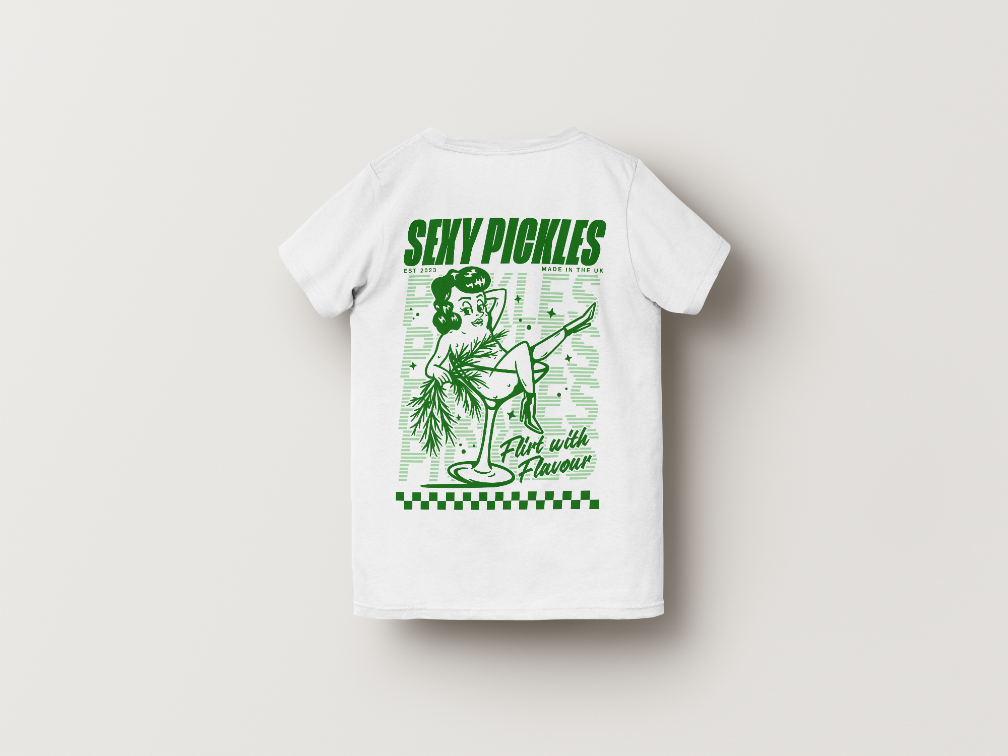 White t-shirt with green graphic design on a light gray background